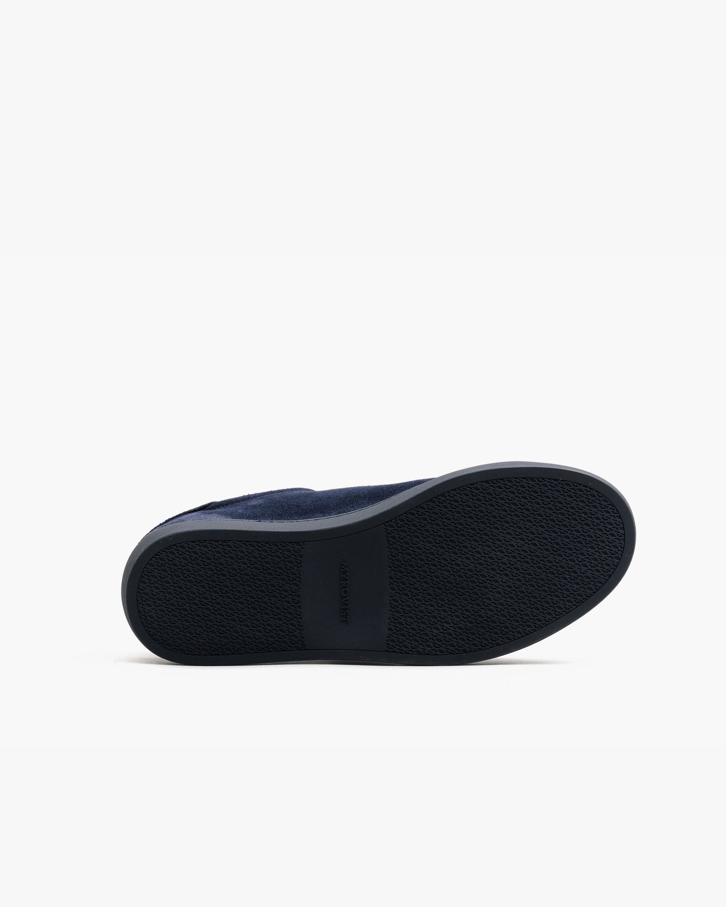 Outsole view of Alnö Monochrome II in midnight blue suede, showing the textured dark rubber sole with MYRQVIST branding at the arch.