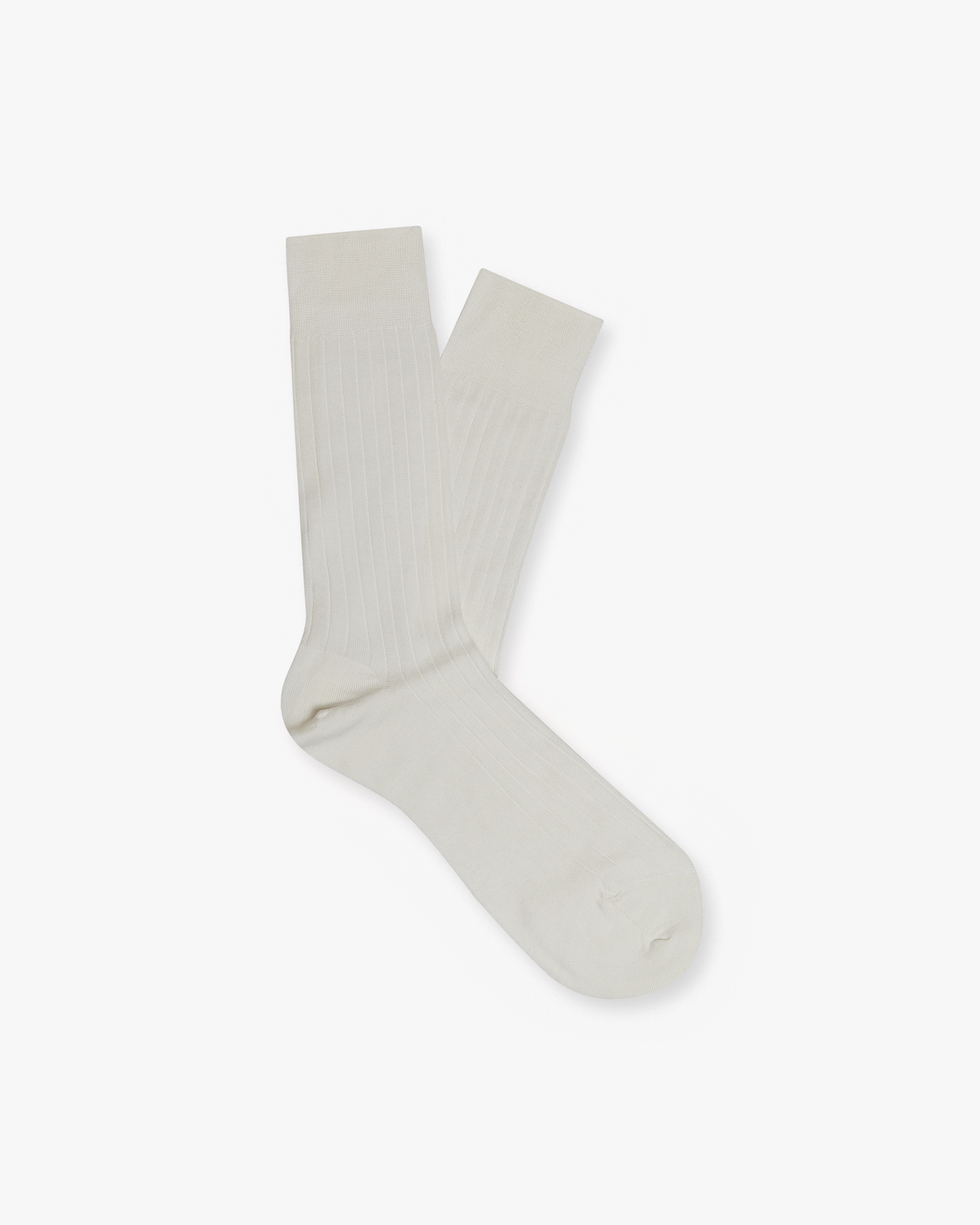 A pair of Alvar – Cotton Socks in pearl, laid flat to showcase their ribbed texture against a white background.