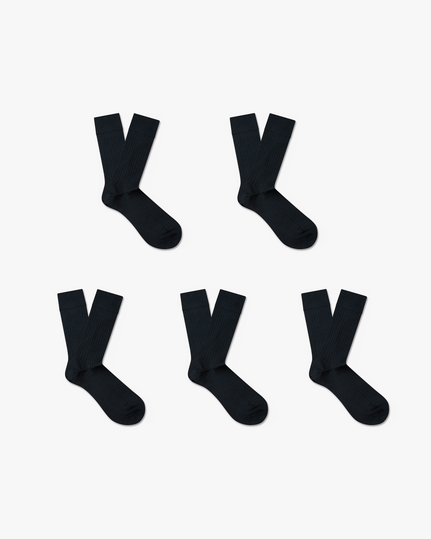 Five pairs of Ludvig merino wool socks in classic black, featuring a ribbed, calf-high design arranged neatly against a white background.