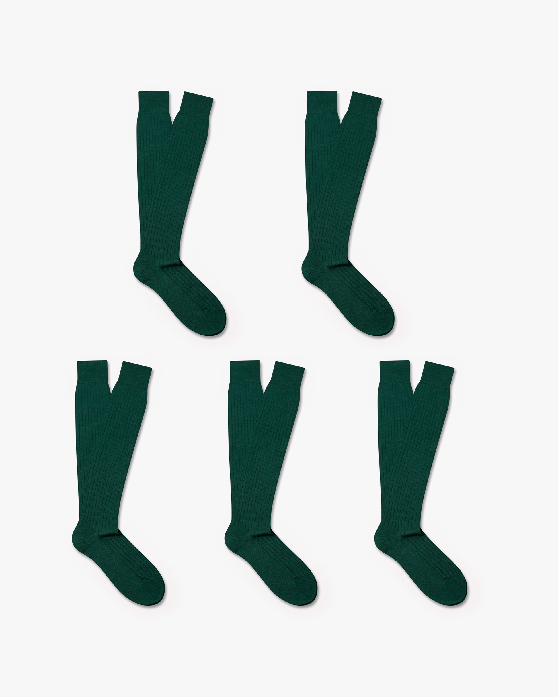 Five pairs of Gustav knee-high merino socks in dark green are arranged on a white background, highlighting their ribbed texture and over-the-calf length.
