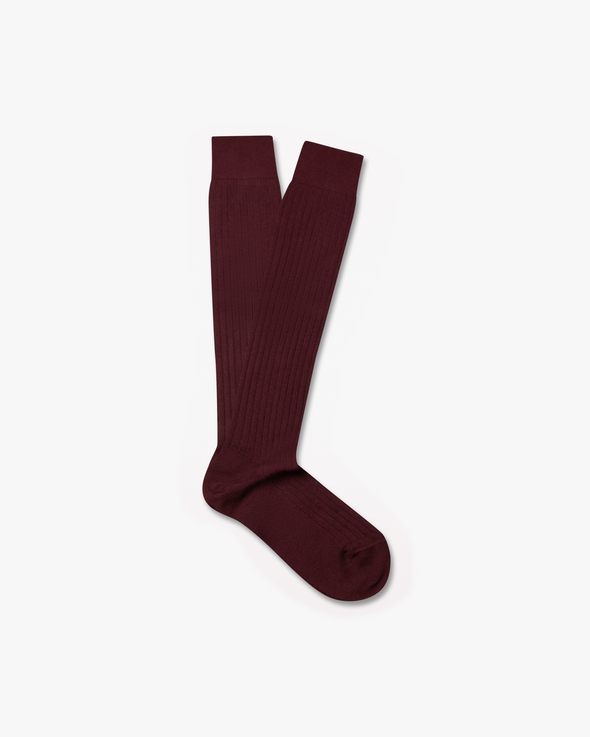 A pair of Nils – Knee-High Cotton Socks – Burgundy, laid flat against a white background.