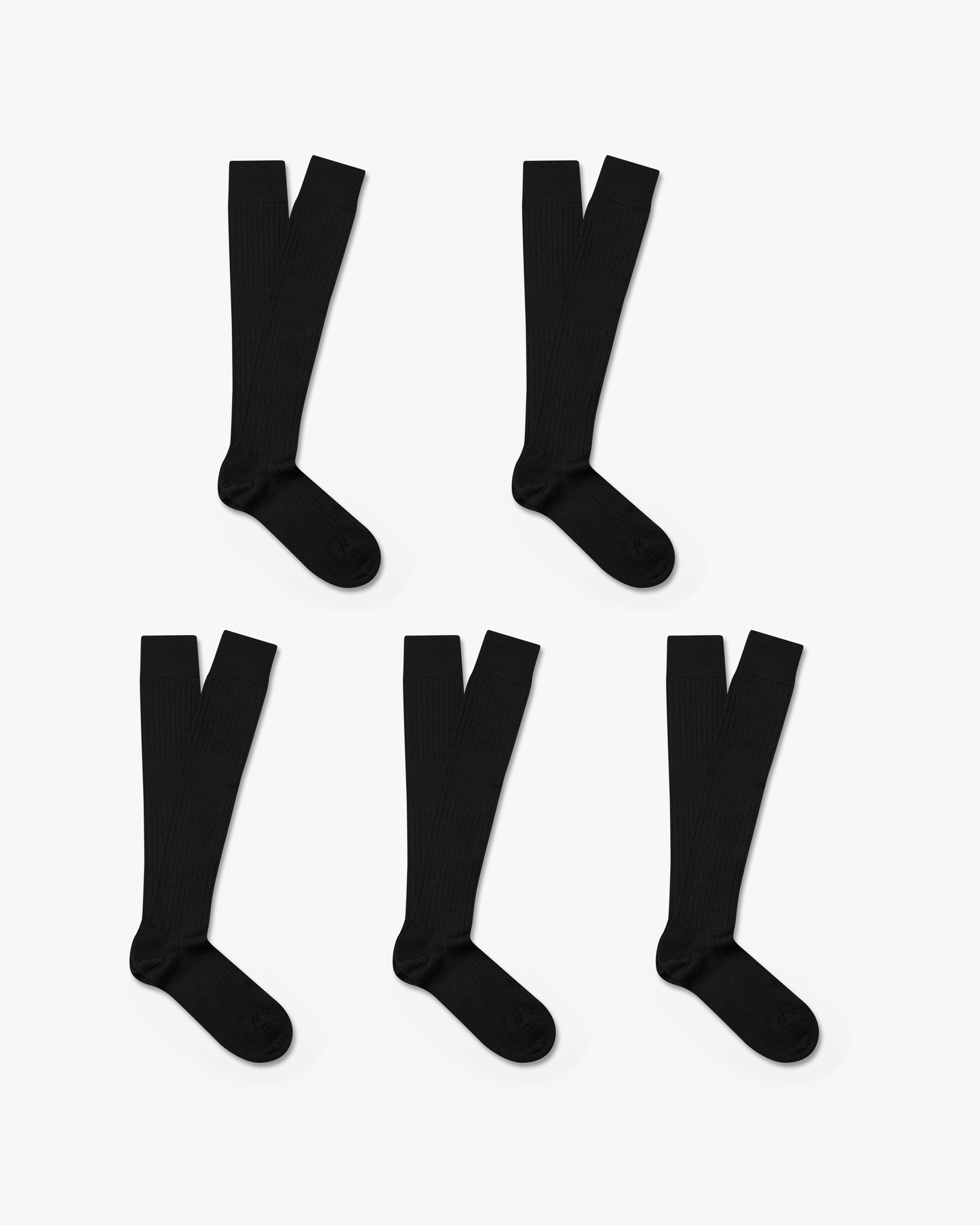 Five pairs of Gustav knee-high merino socks in classic black are displayed on a white background, highlighting their ribbed texture and over-the-calf fit for a polished, versatile style.