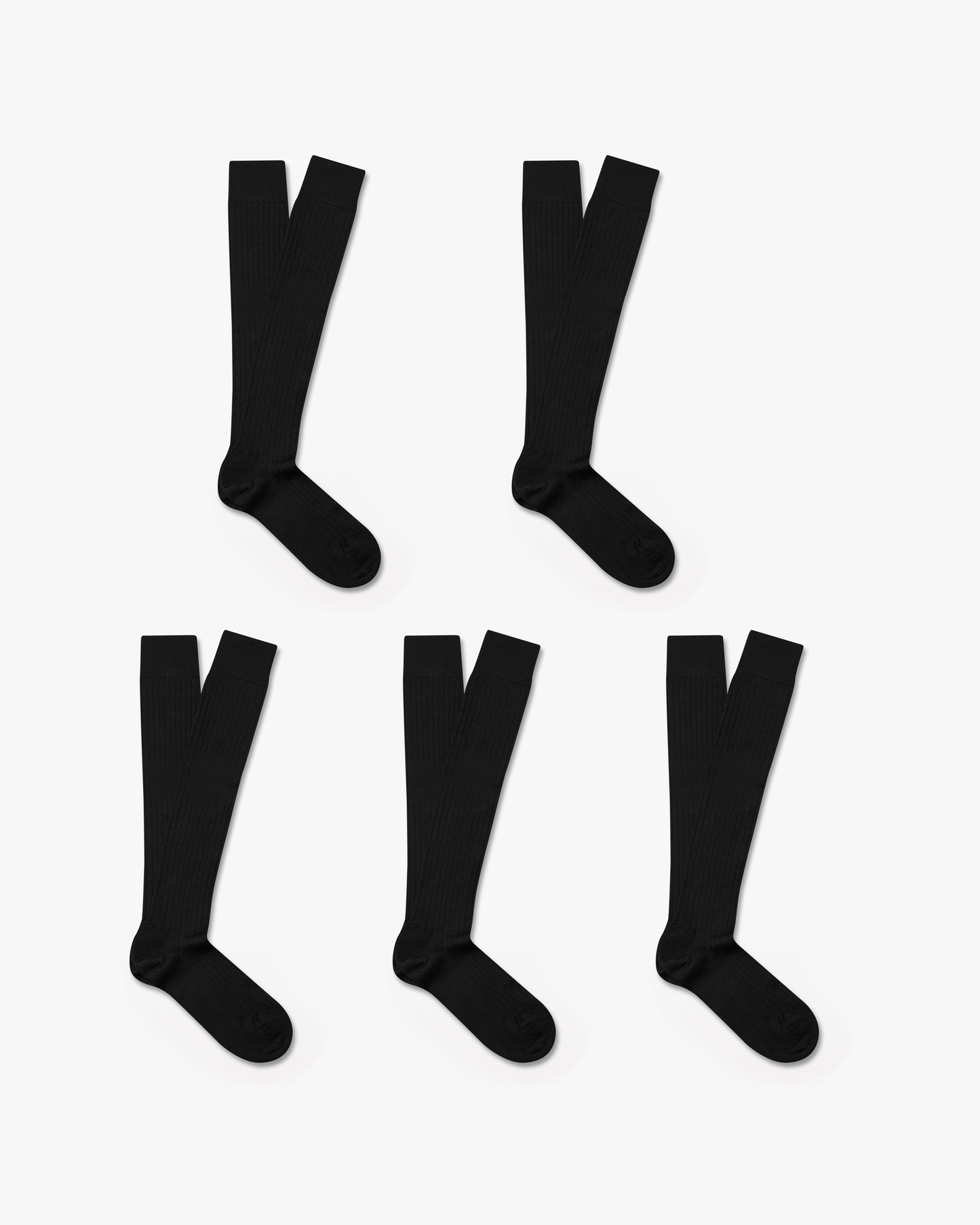 Five pairs of Gustav knee-high merino socks in black are neatly arranged on a white background, showcasing their ribbed texture and over-the-calf length.