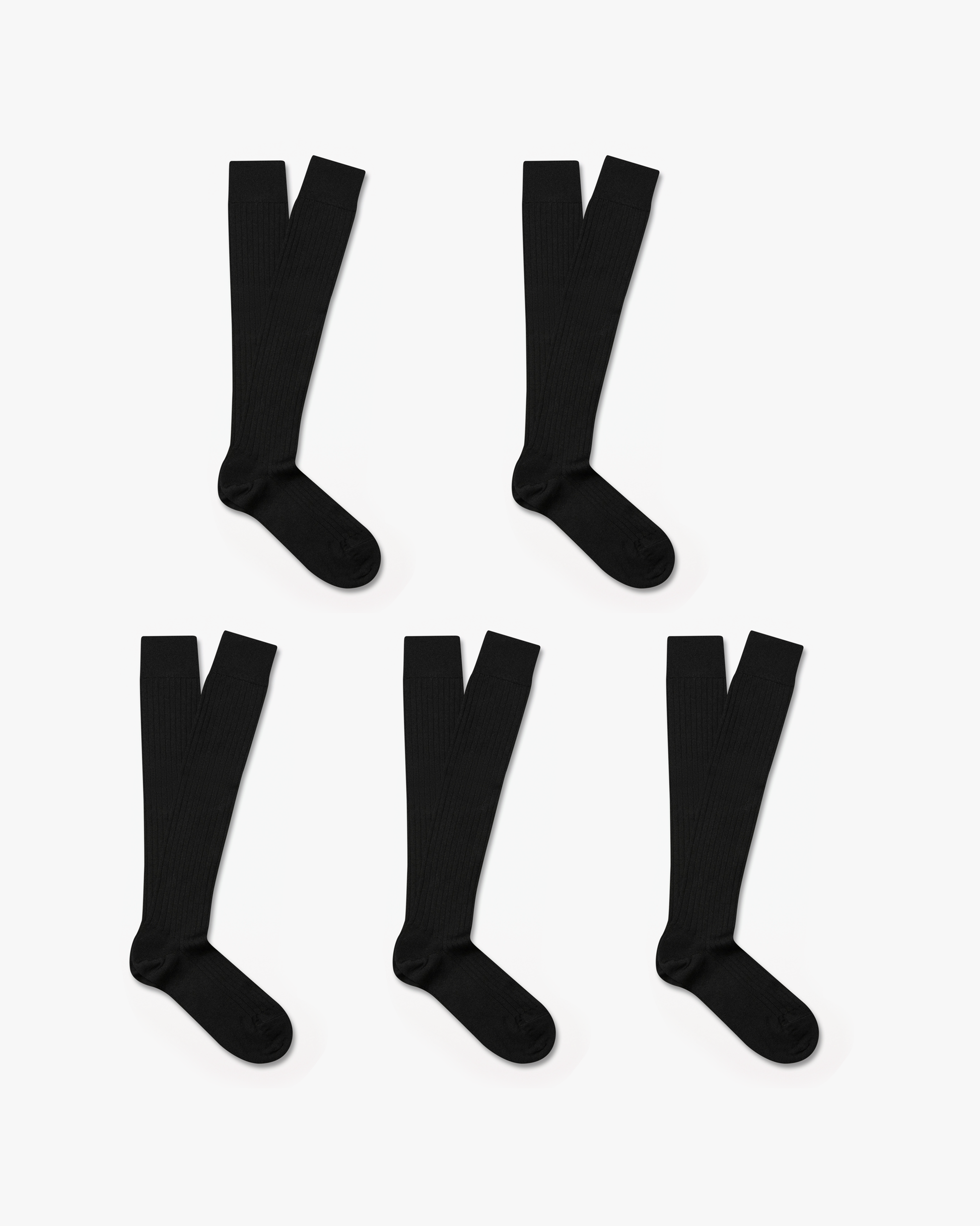 Five pairs of Gustav knee-high merino socks in black are neatly arranged on a white background, showcasing their ribbed texture and over-the-calf length.