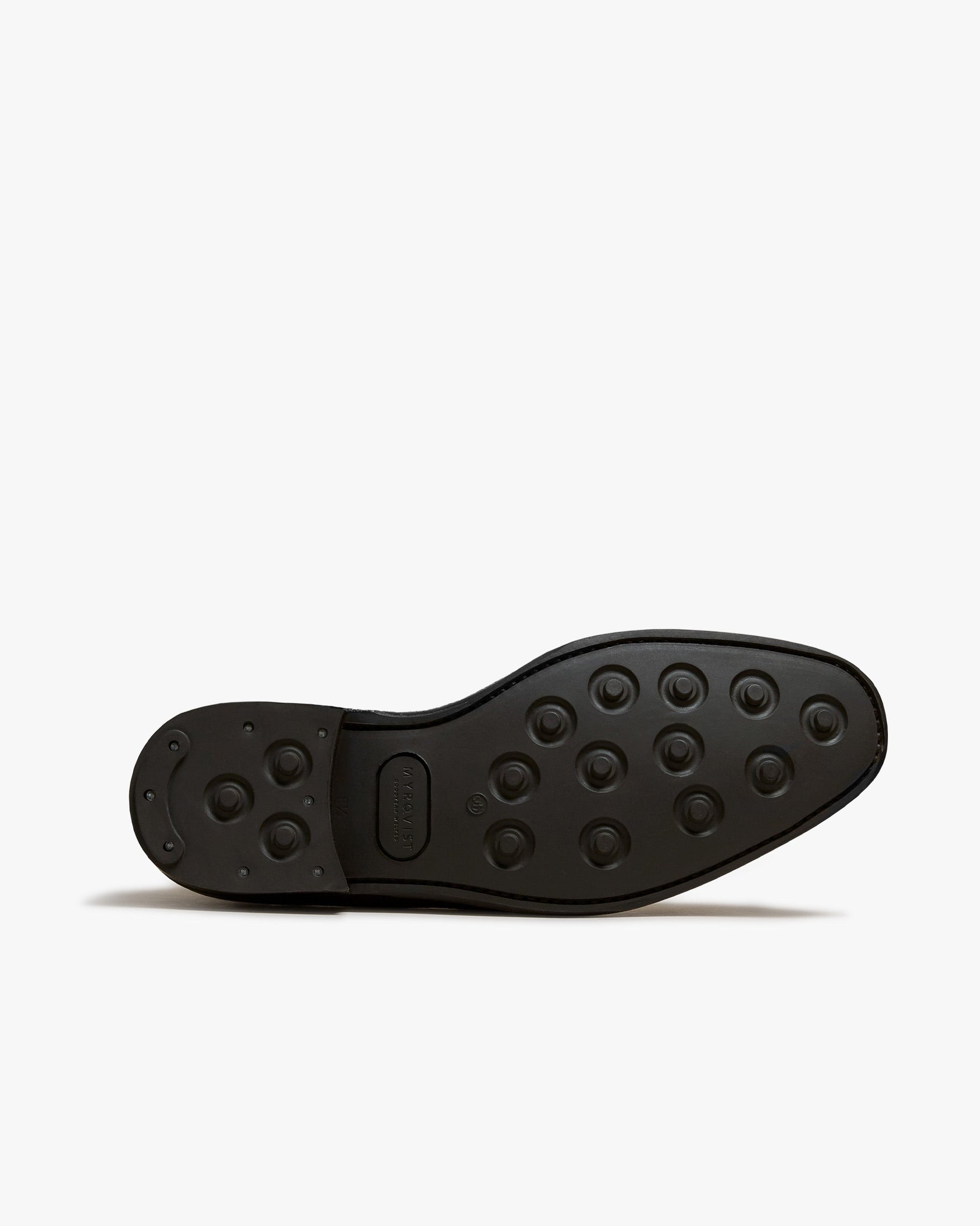 Close-up of the studded rubber sole on Granhult in dark brown calf, highlighting the durable construction and grip designed for versatile wear.