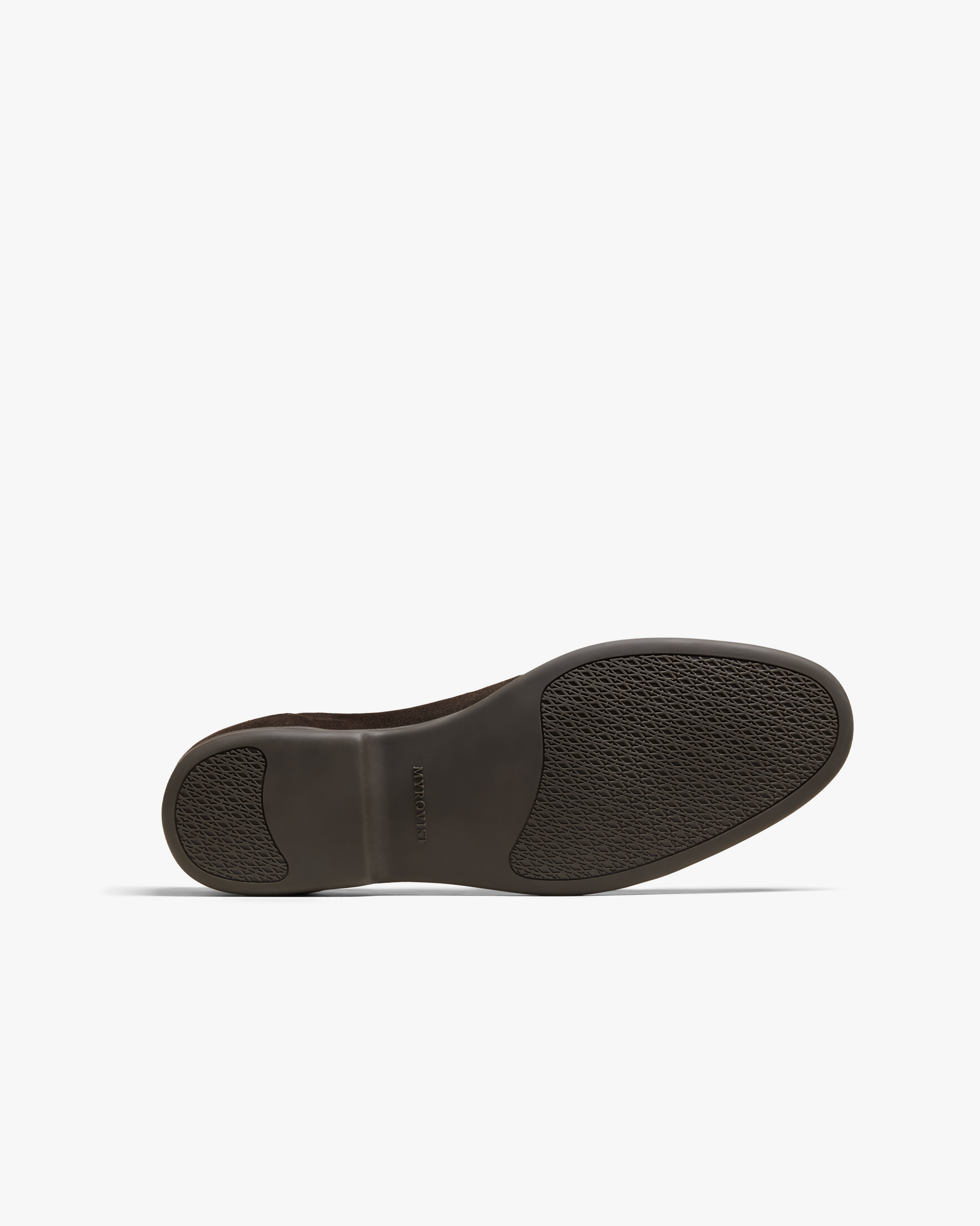 Brännö II in dark brown suede shown from below, featuring a tonal rubber sole with textured grip panels and subtle Myrqvist branding at the midfoot.