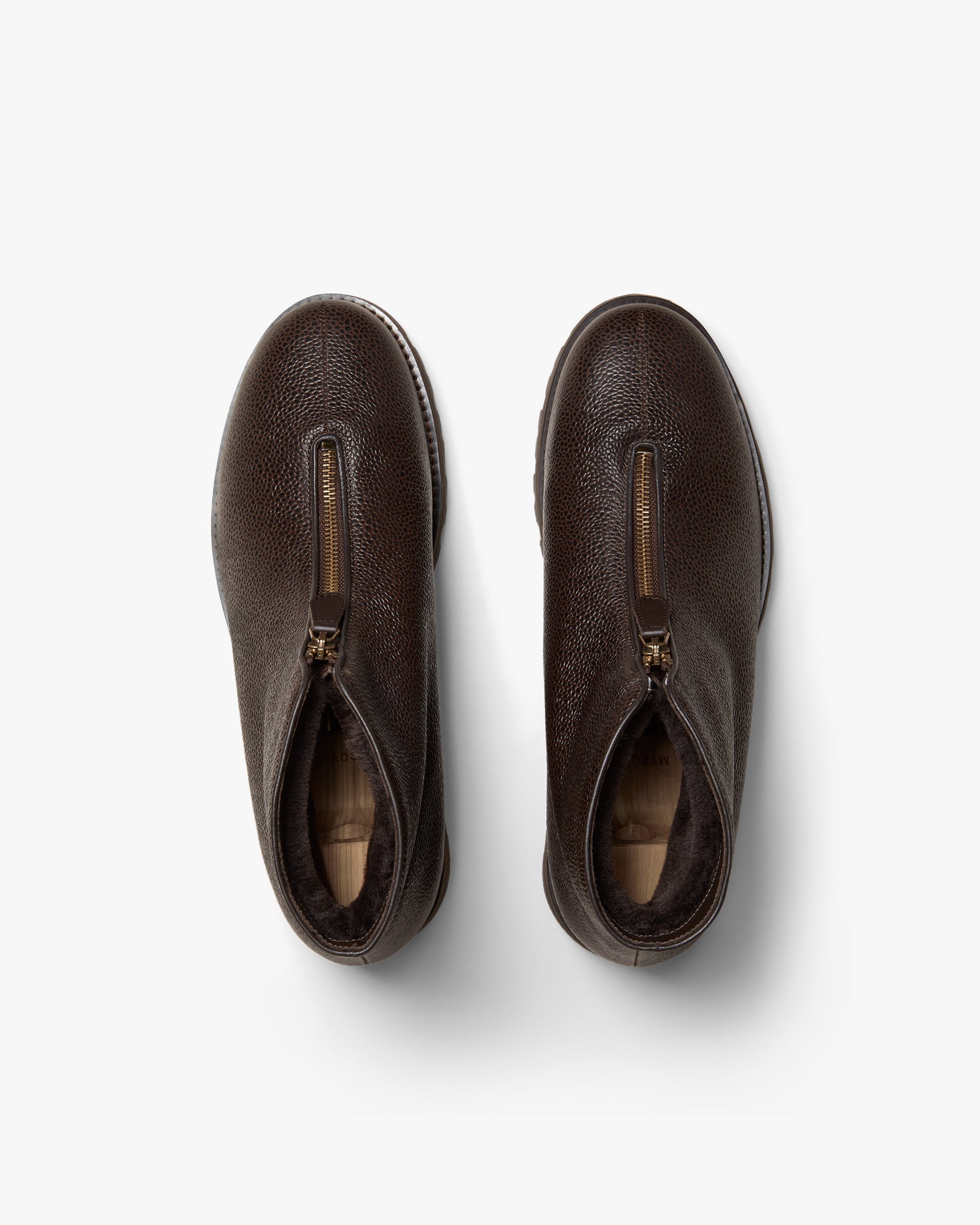 Top view of Funäs in dark brown country calf, highlighting the textured leather, central zipper closures, and plush shearling lining for added warmth.
