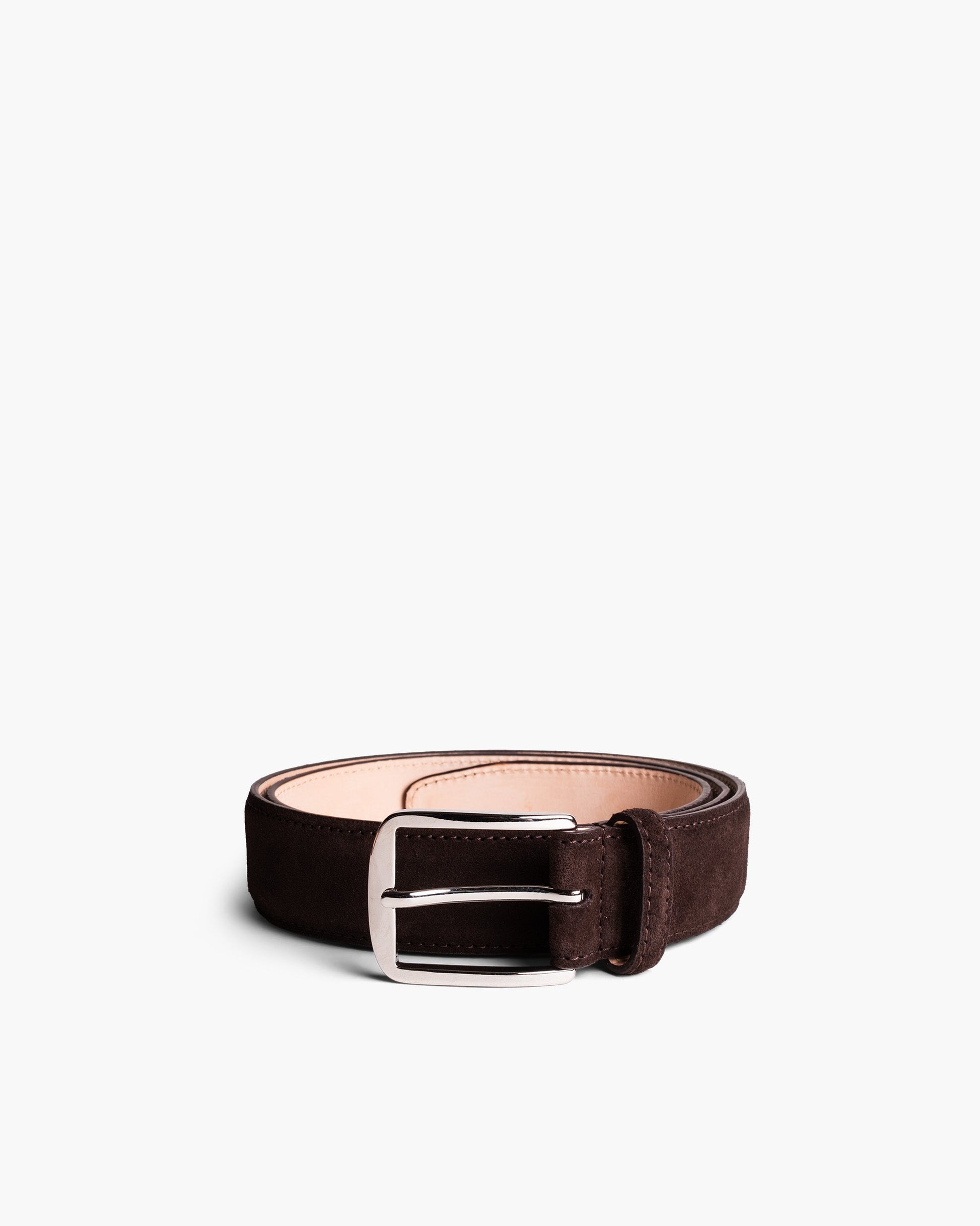 Dark brown suede belt with a square silver buckle, featuring precise stitching and a soft leather lining, coiled neatly against a white background.