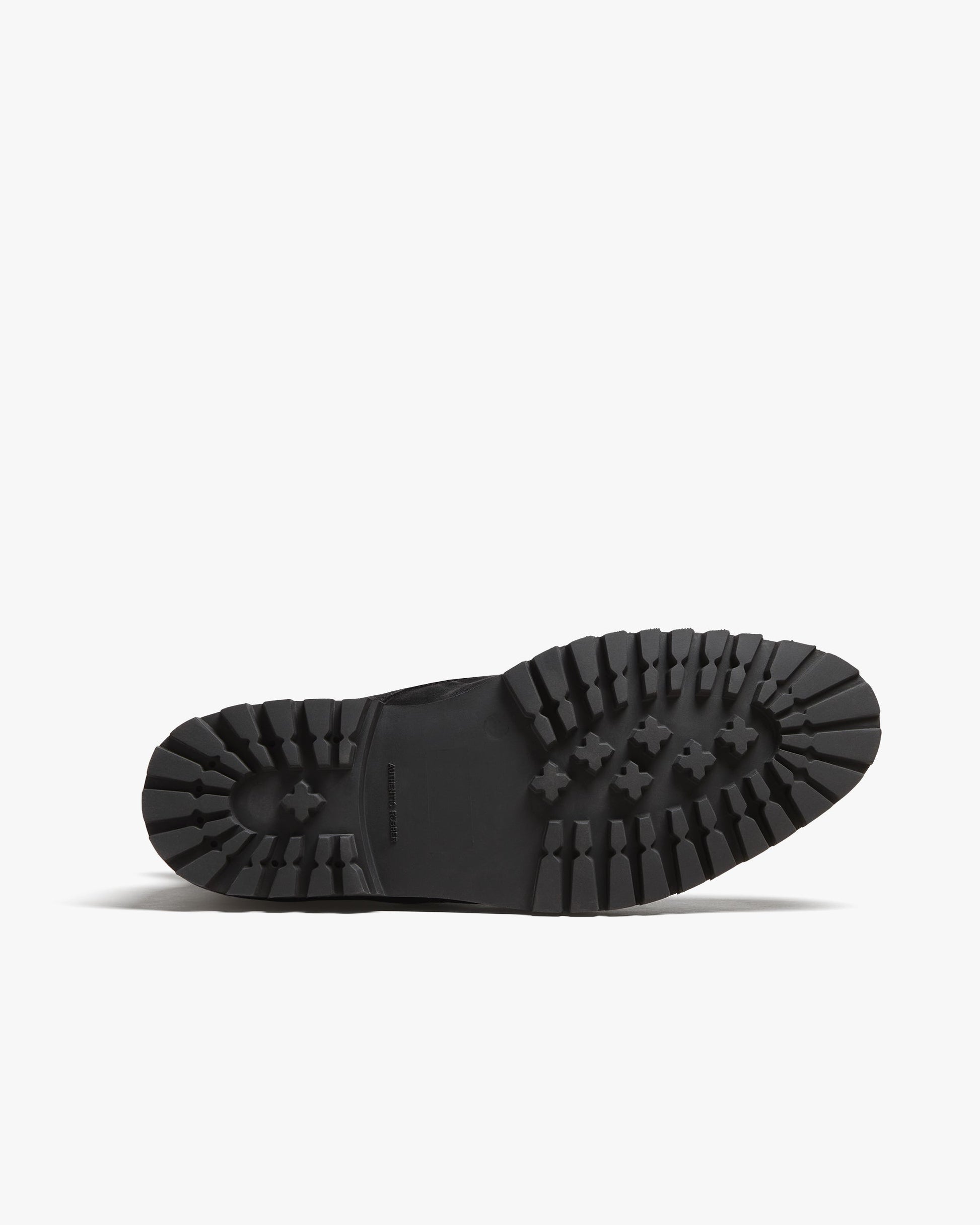 Close-up of the Gothem II in black suede showing the rugged lug sole with deep tread, designed for reliable traction and durability in winter boots for men.