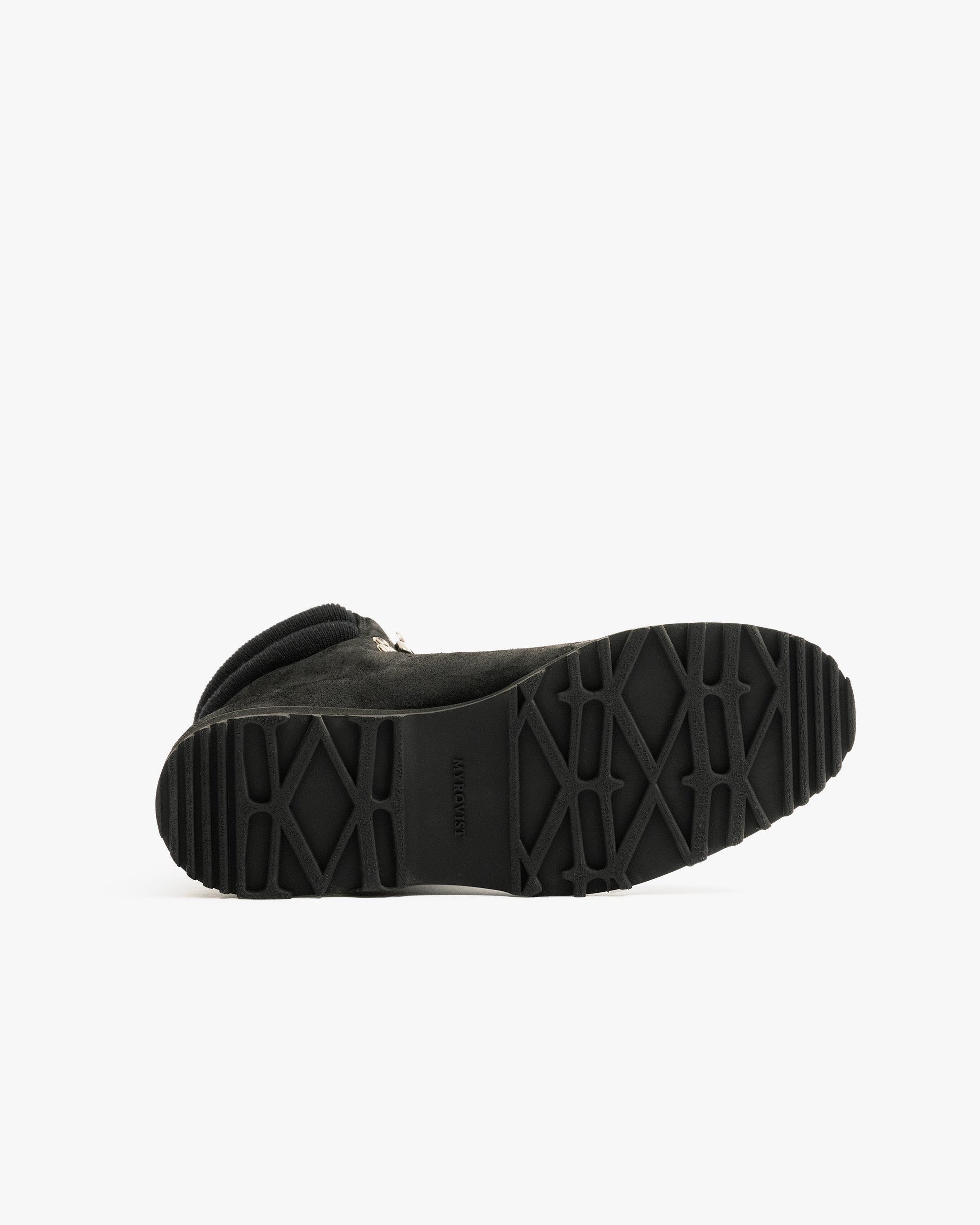 Duved in black waxed suede shown from the sole, highlighting the durable, textured hiking sole designed for traction and stability in both urban and outdoor environments.