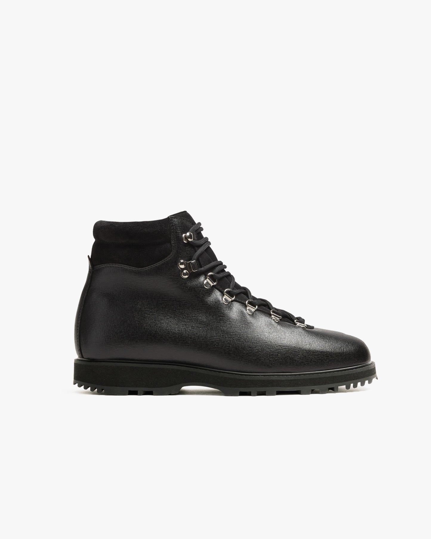 Duved boot in black grain calf features a textured leather upper, silver-toned hardware, and a padded collar, set on a rugged hiking sole for versatile city or outdoor wear.