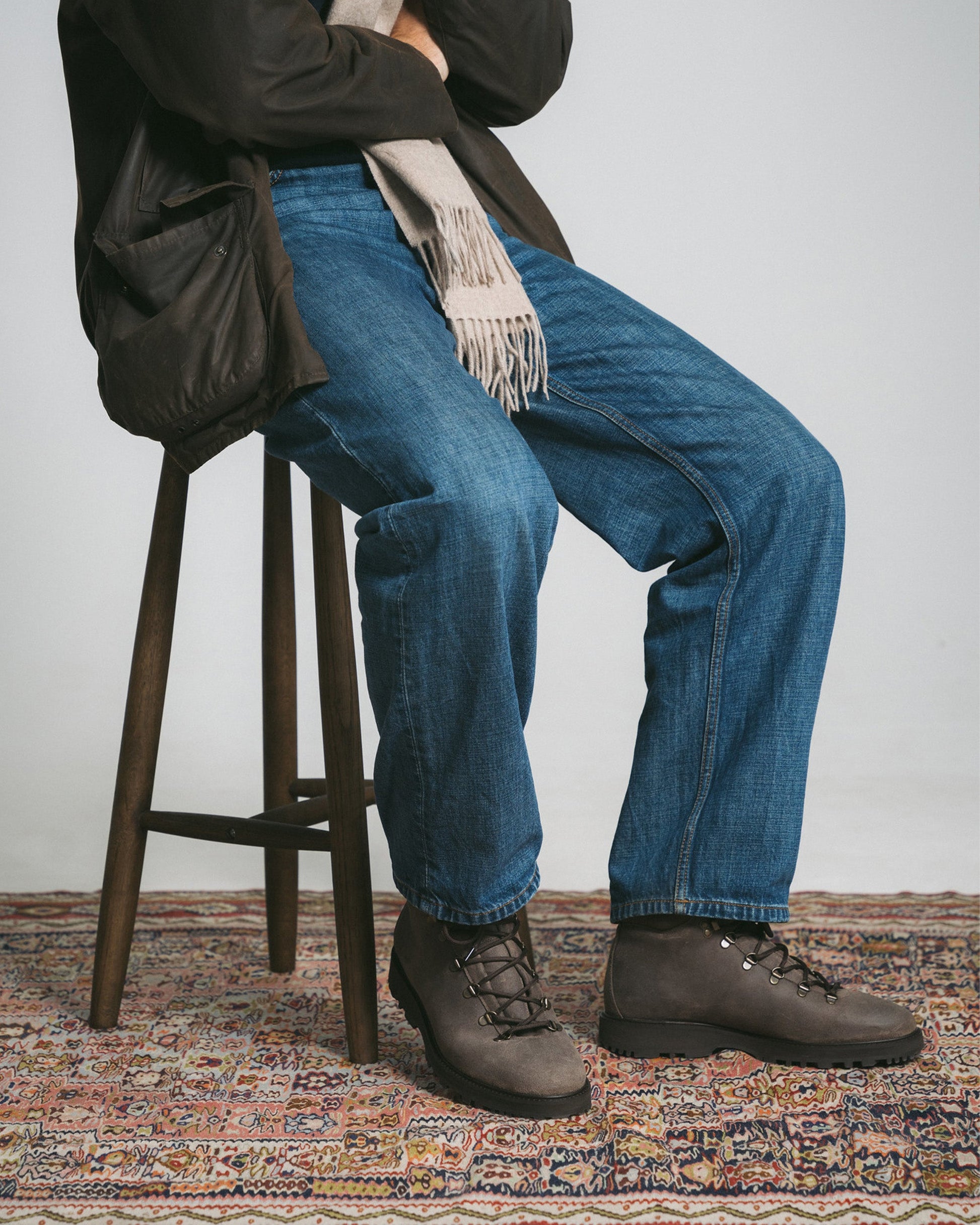 Duved in taupe waxed suede styled with denim, a dark jacket, and a light scarf, showcasing the hiking boot’s versatility for casual city wear and relaxed weekend looks.