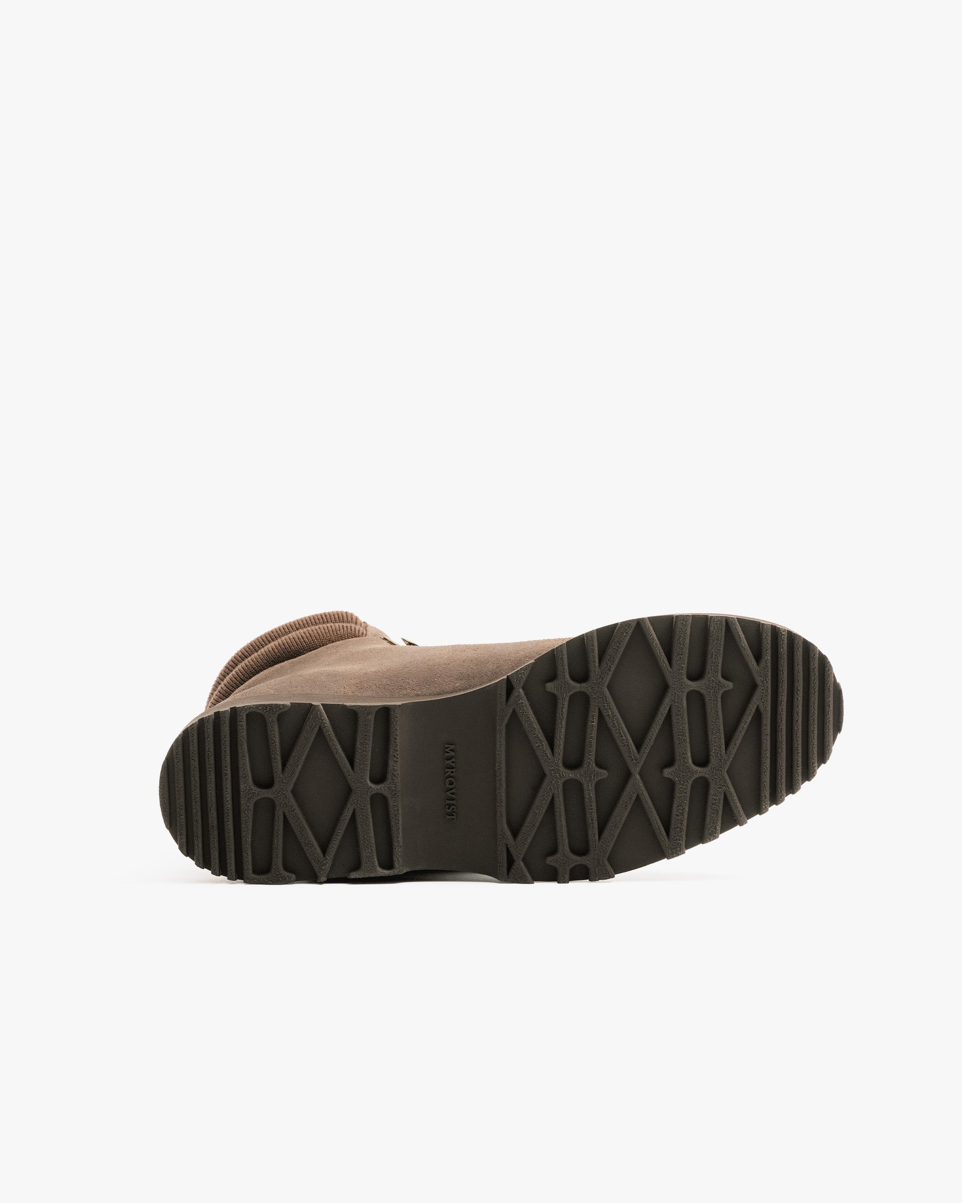 Duved in taupe waxed suede shown from the sole, featuring a rugged tread pattern designed for reliable grip and stability on varied terrain.