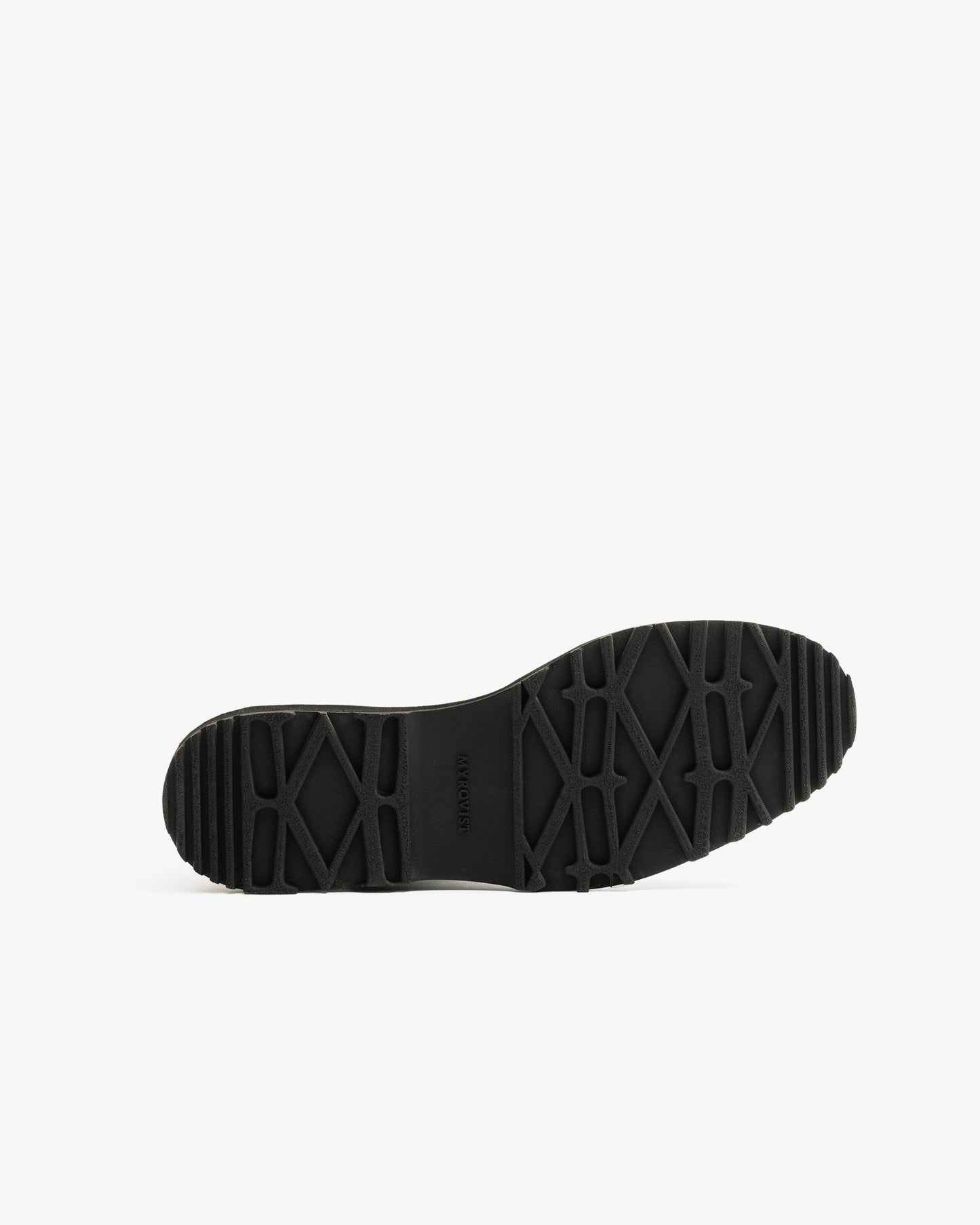Close-up of the Duved in black grain calf showing the rugged, textured hiking sole designed for reliable traction and durability on varied terrain.