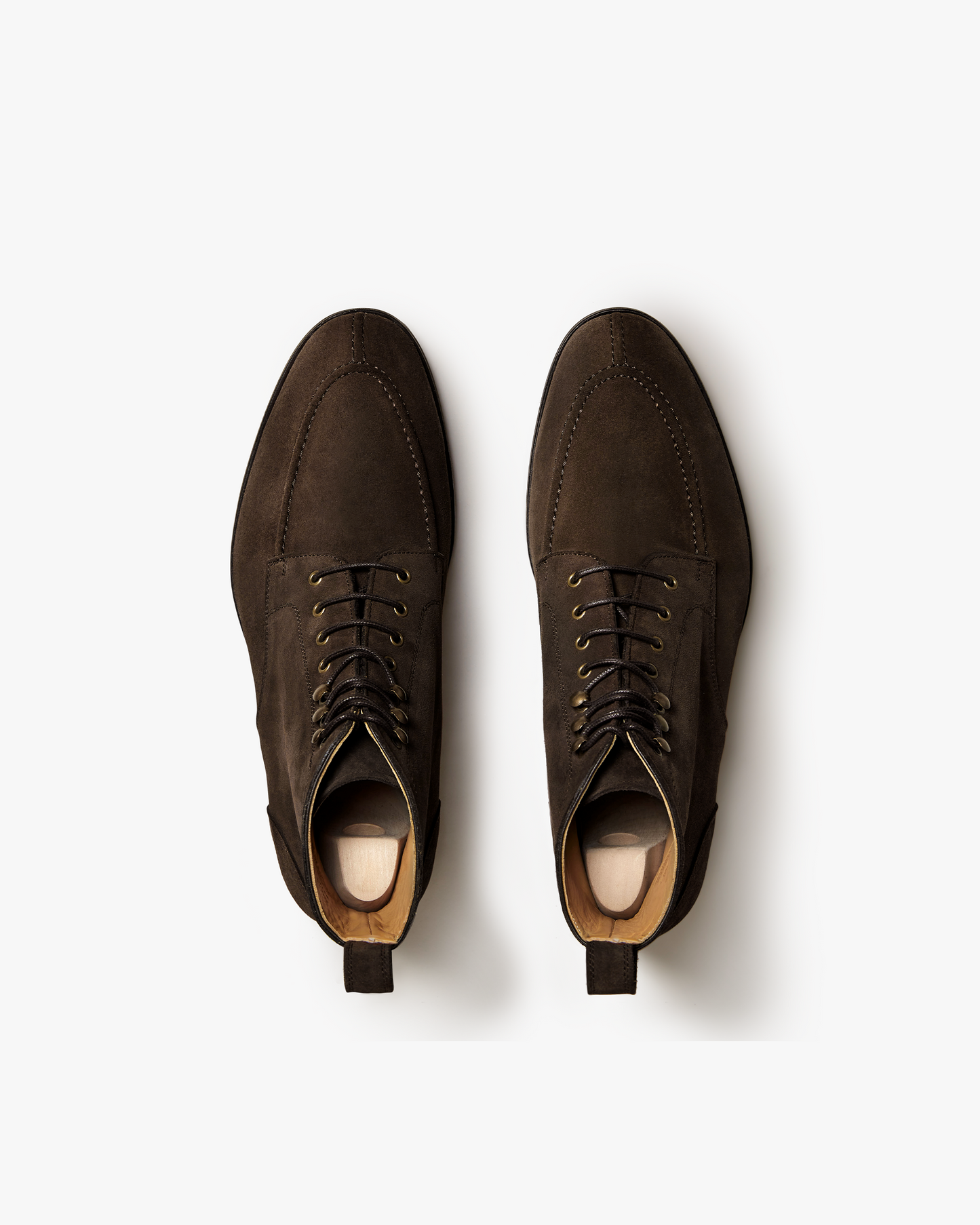 Pair of Gothem II in dark brown suede shown from above, highlighting the split toe apron, brass speed hooks, and rich suede texture with full leather lining visible inside each boot.