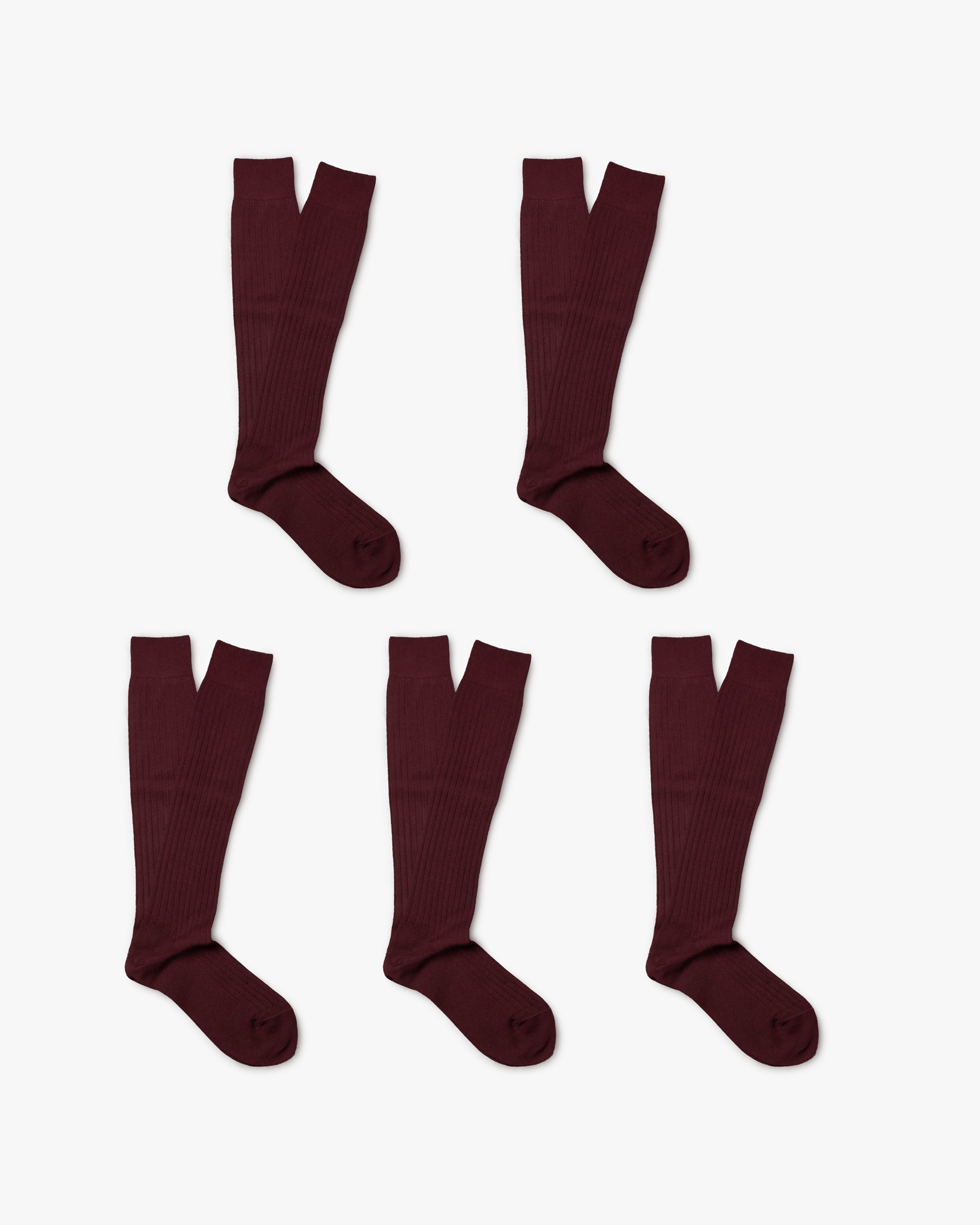 Five pairs of Gustav knee-high merino socks in deep burgundy are displayed on a white background, emphasizing their ribbed design and over-the-calf length.