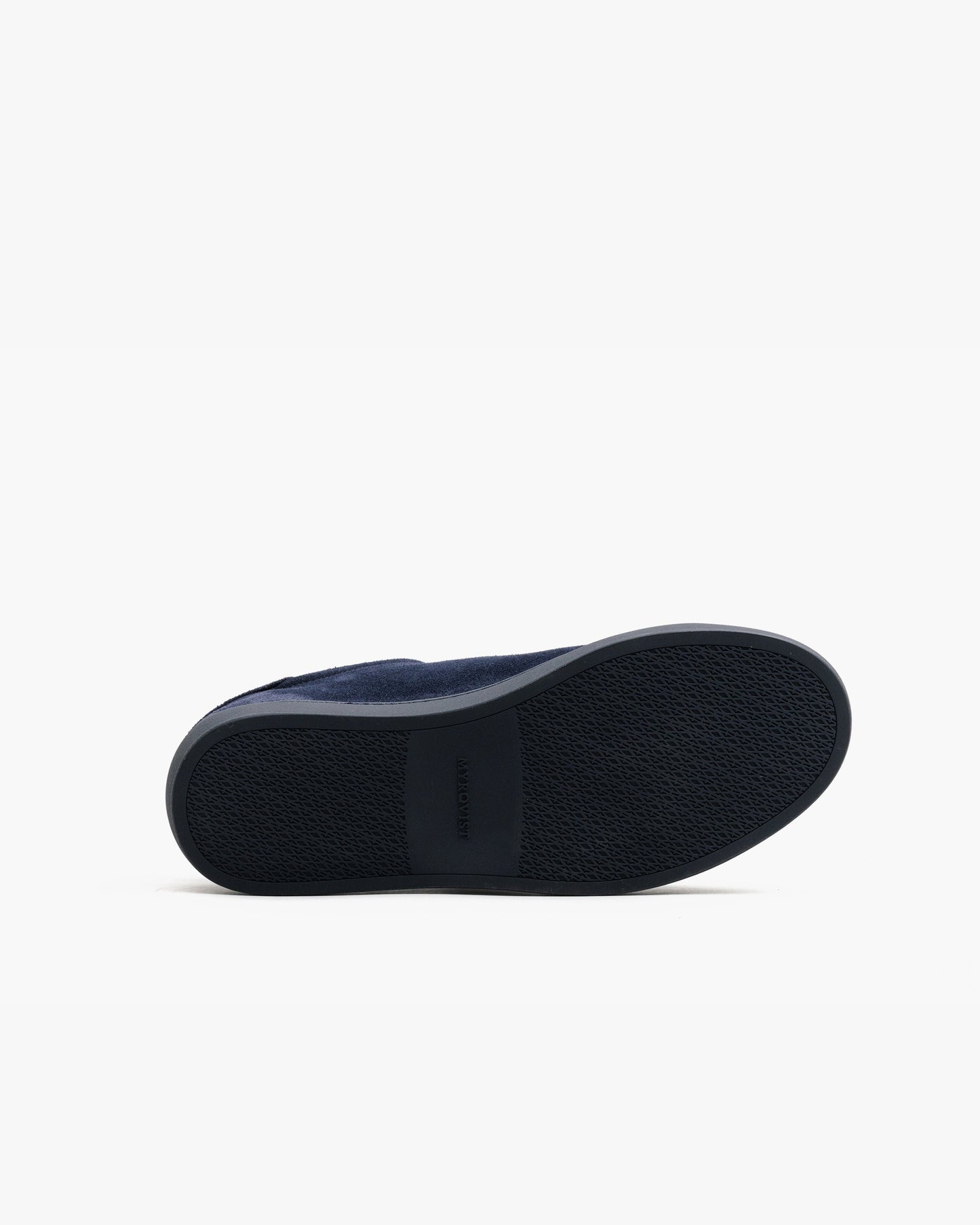 Oaxen Monochrome in navy suede shown with the sole facing up, highlighting the textured M-pattern sole and subtle Myrqvist branding for grip and durability.