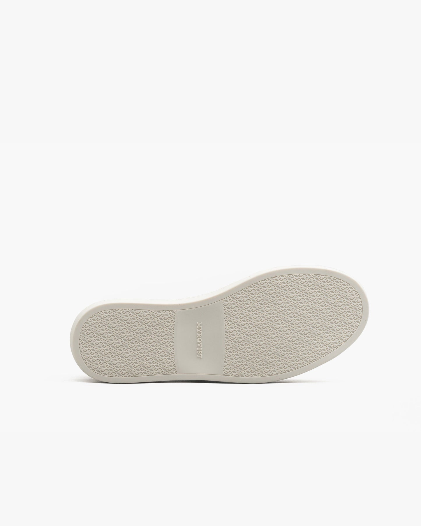 The sole of Oaxen in dark brown calf is shown from below, featuring a textured white rubber surface with the MYRQVIST logo embossed at the center for grip and subtle branding.