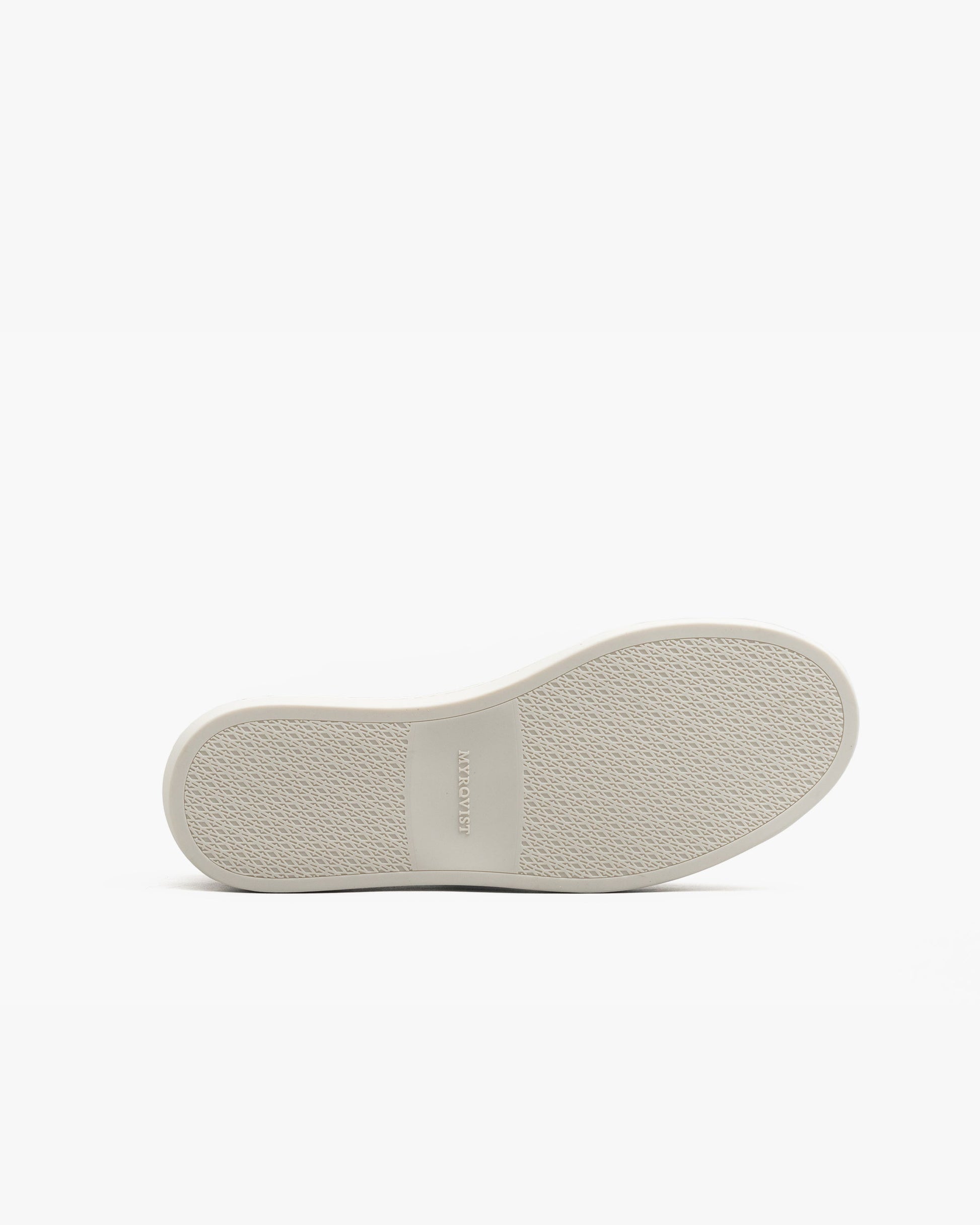 The sole of Oaxen in dark brown calf is shown from below, featuring a textured white rubber surface with the MYRQVIST logo embossed at the center for grip and subtle branding.