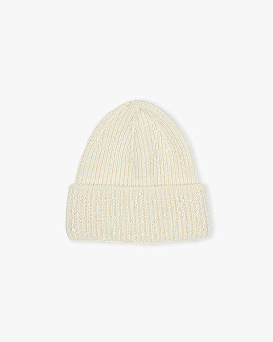 A ribbed hat in cream, made from a blend of merino wool and cashmere, pictured against a white background.