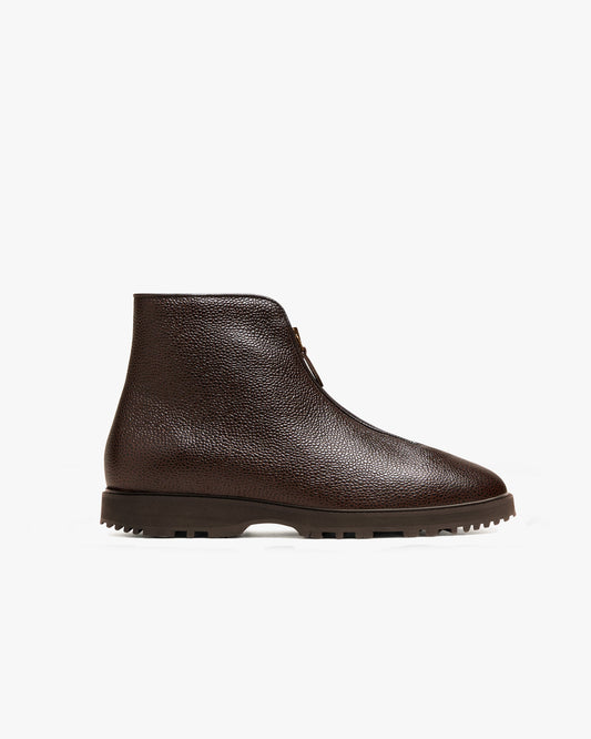 Side view of Funäs in dark brown country calf, showcasing its textured leather upper, central zipper with leather pull, and sturdy Explorer sole designed for grip and comfort.