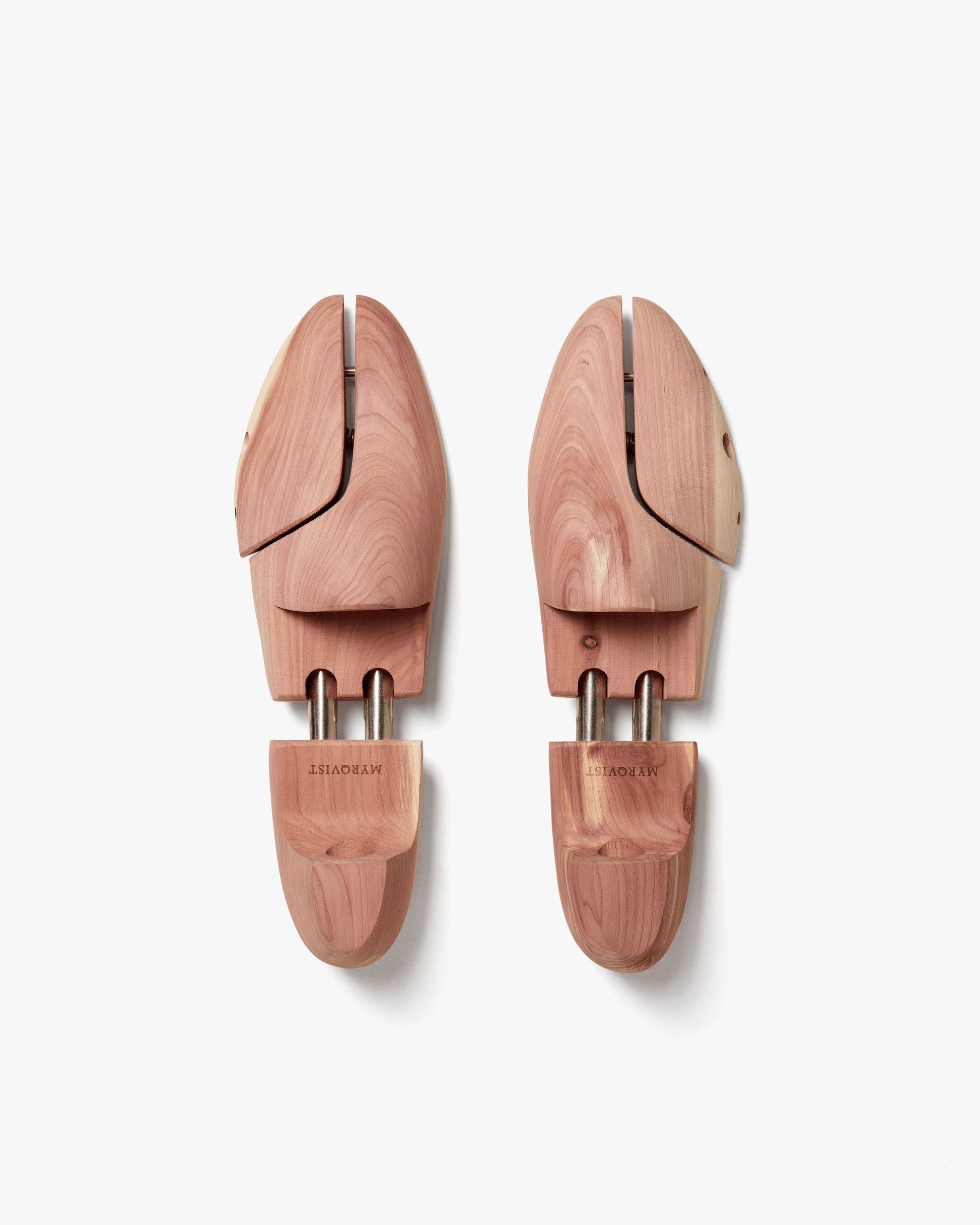 Pair of Myrqvist split toe shoe trees in cedar wood, featuring adjustable tension and engraved branding, designed to maintain the shape and freshness of dress shoes or boots.