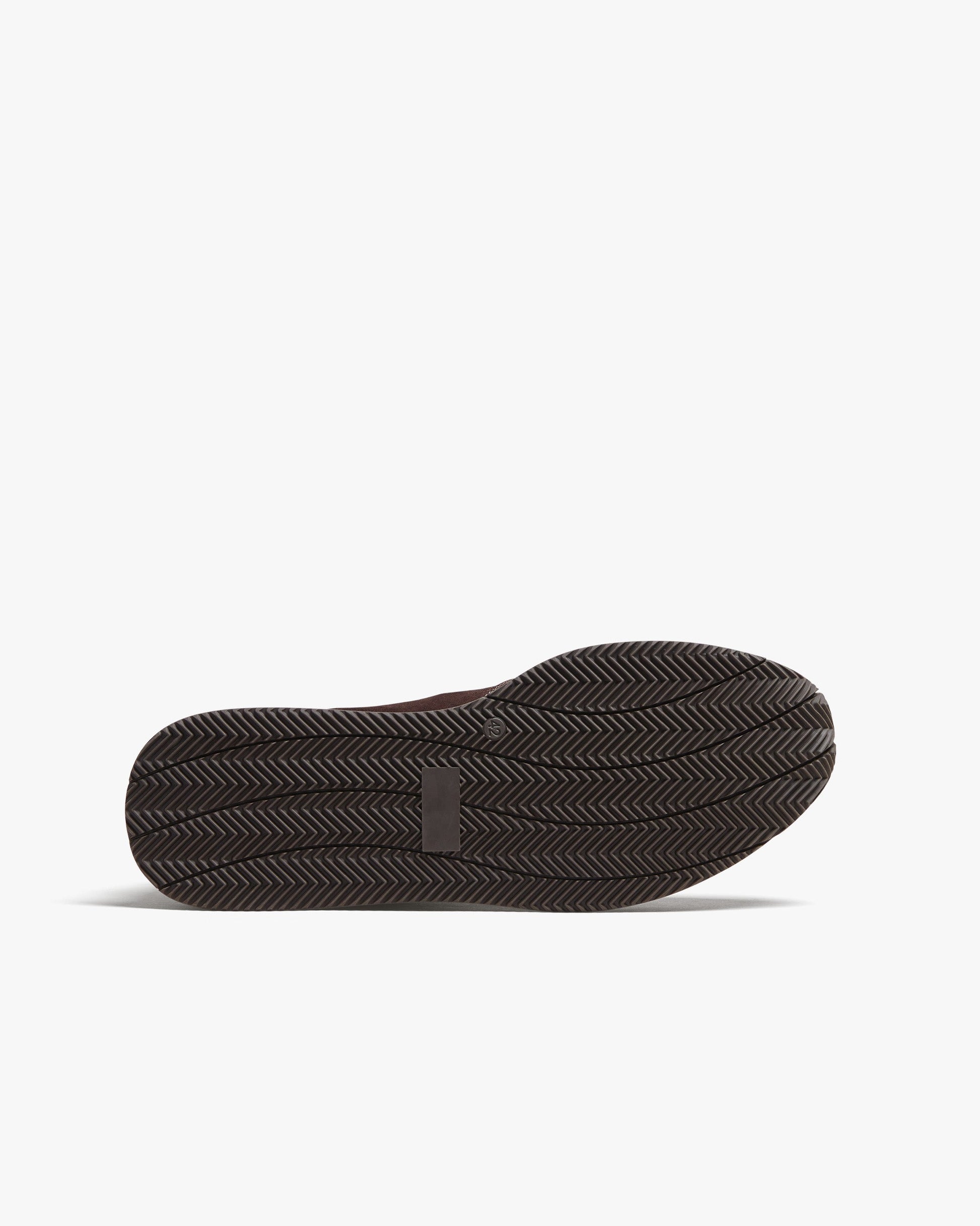 Close-up of the Stensund in dark brown suede showing the sculpted rubber sole with a herringbone tread pattern designed for reliable grip and everyday versatility.