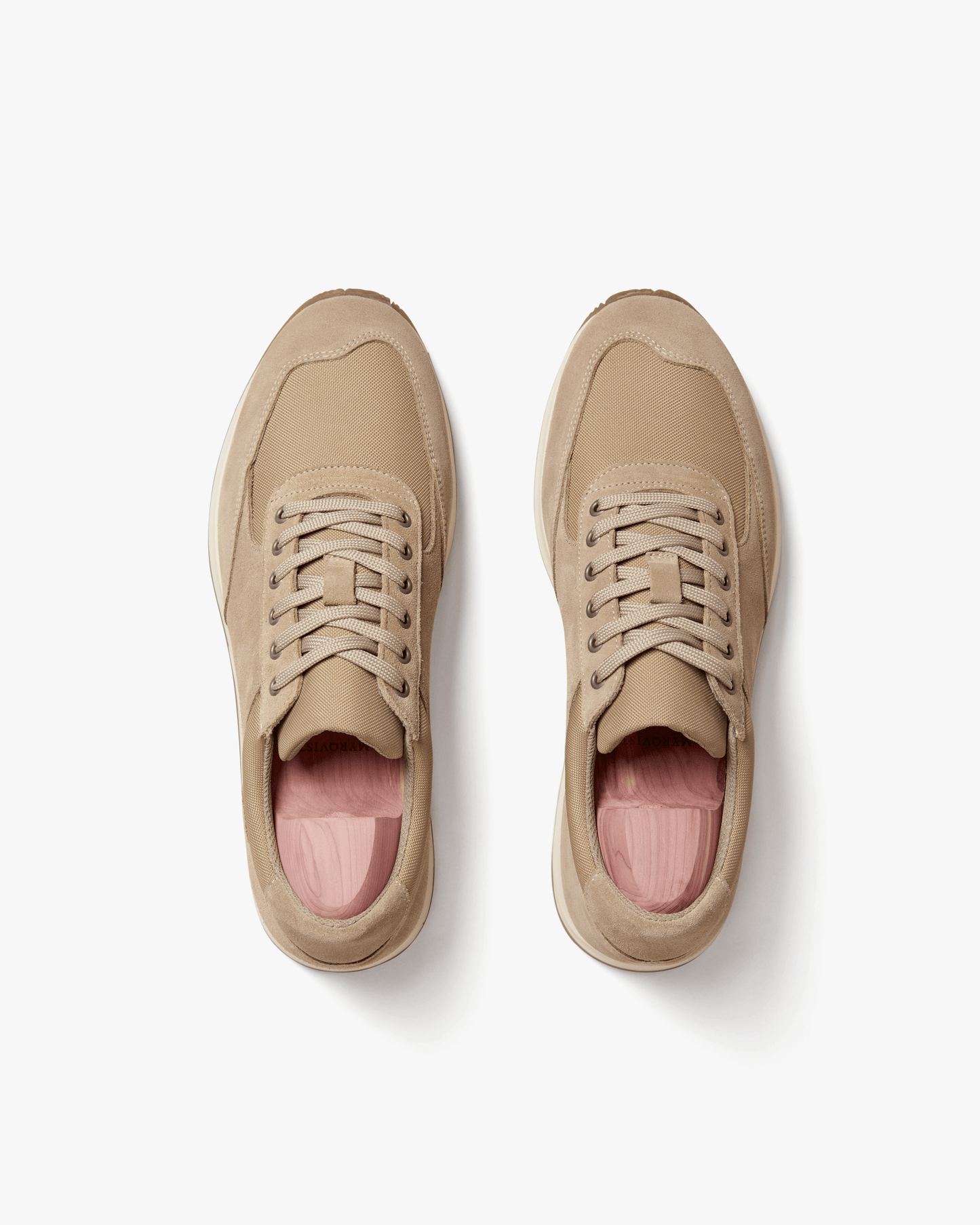 Stensund in sand suede shown from above, highlighting the soft beige suede, tonal mesh panels, and cushioned interior designed for comfort and breathability.